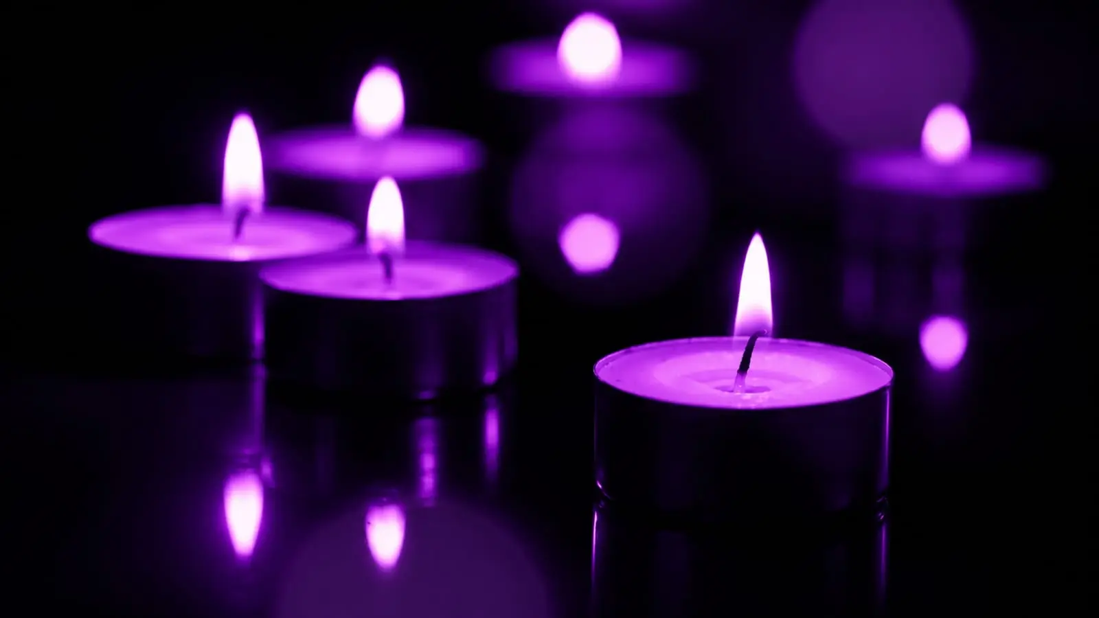 Glowing purple candles representing Indian festival season content opportunities for creators