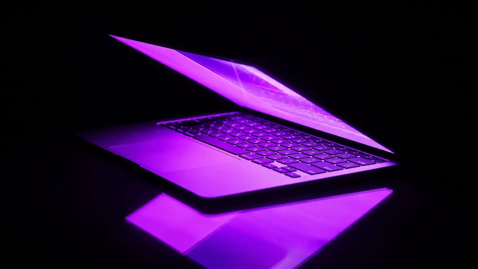 glowing purple laptop representing Indian creator choosing between Instagram Reels and YouTube Shorts strategy 2026