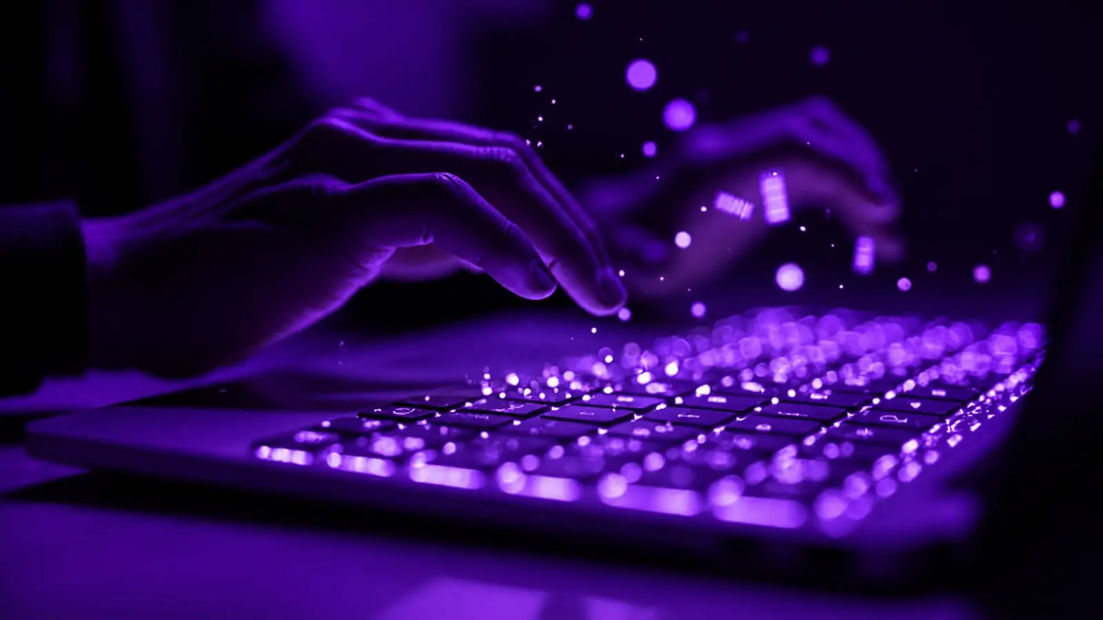 Hands typing on glowing keyboard representing content writing strategy for viral titles